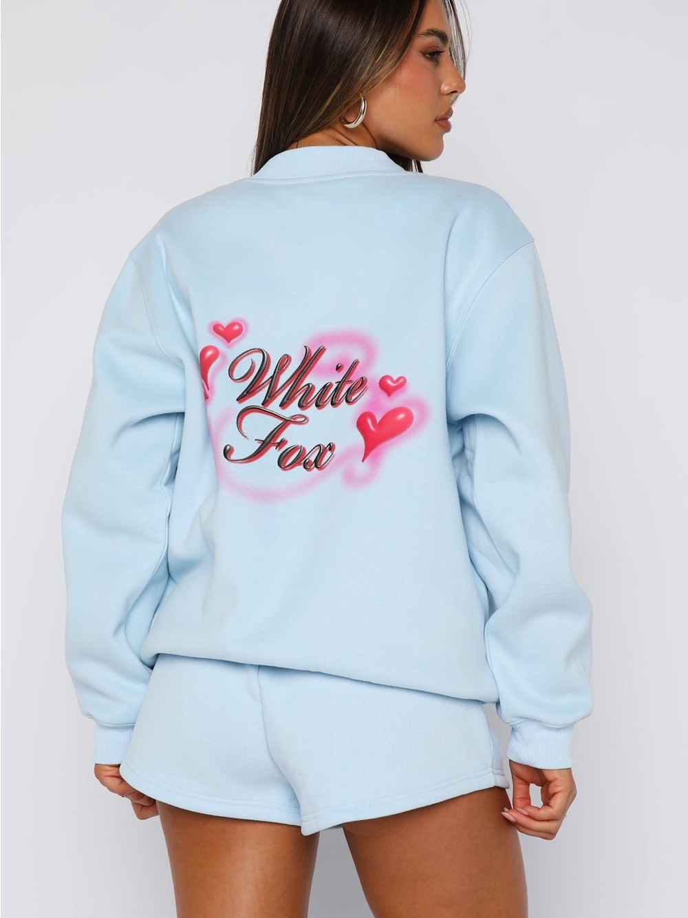 White Fox Boutique Light Blue Sweatshirt with Pink Heart Accents
